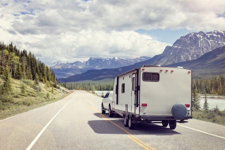 caravan or motor home trailer on a mountain road PNWJVLC