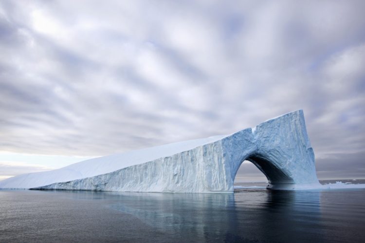 an iceberg on the water of baffin bay with a natur NZ95NWP